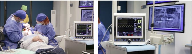Echipă medicală operând în blocul chirurgical Implantodent, alături de monitorul care afișează continuu funcțiile vitale ale pacientului
