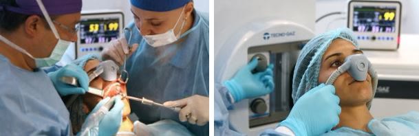 Pacientă cu masca nazală de protoxid de azot în timpul unui tratament dentar, monitorizată de echipa clinicii